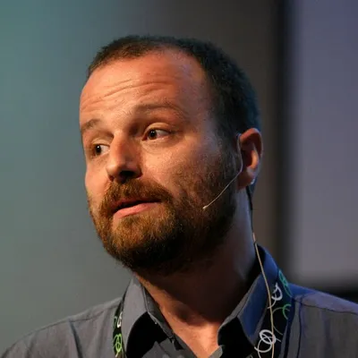 A portrait of Tamás Cservenák